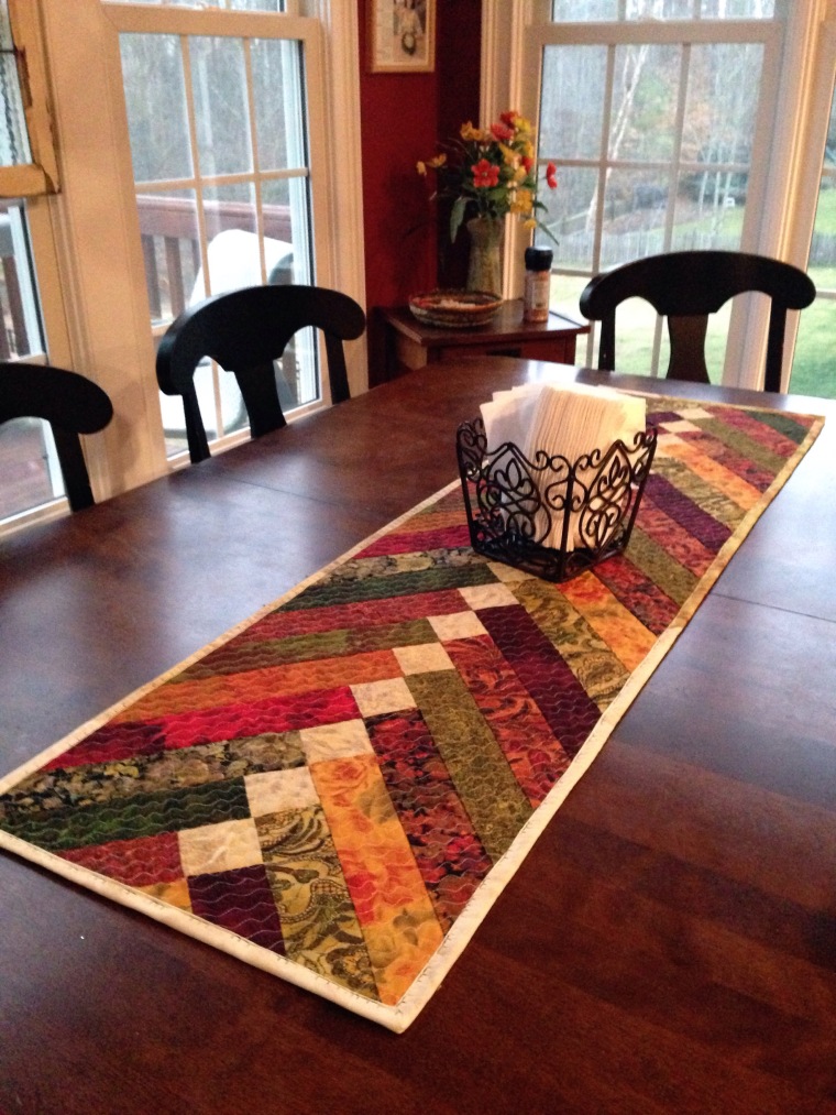"French Braid Table Runner" is a Free Table Top Quilted Pattern designed by Debbe from Rags to Fishes!